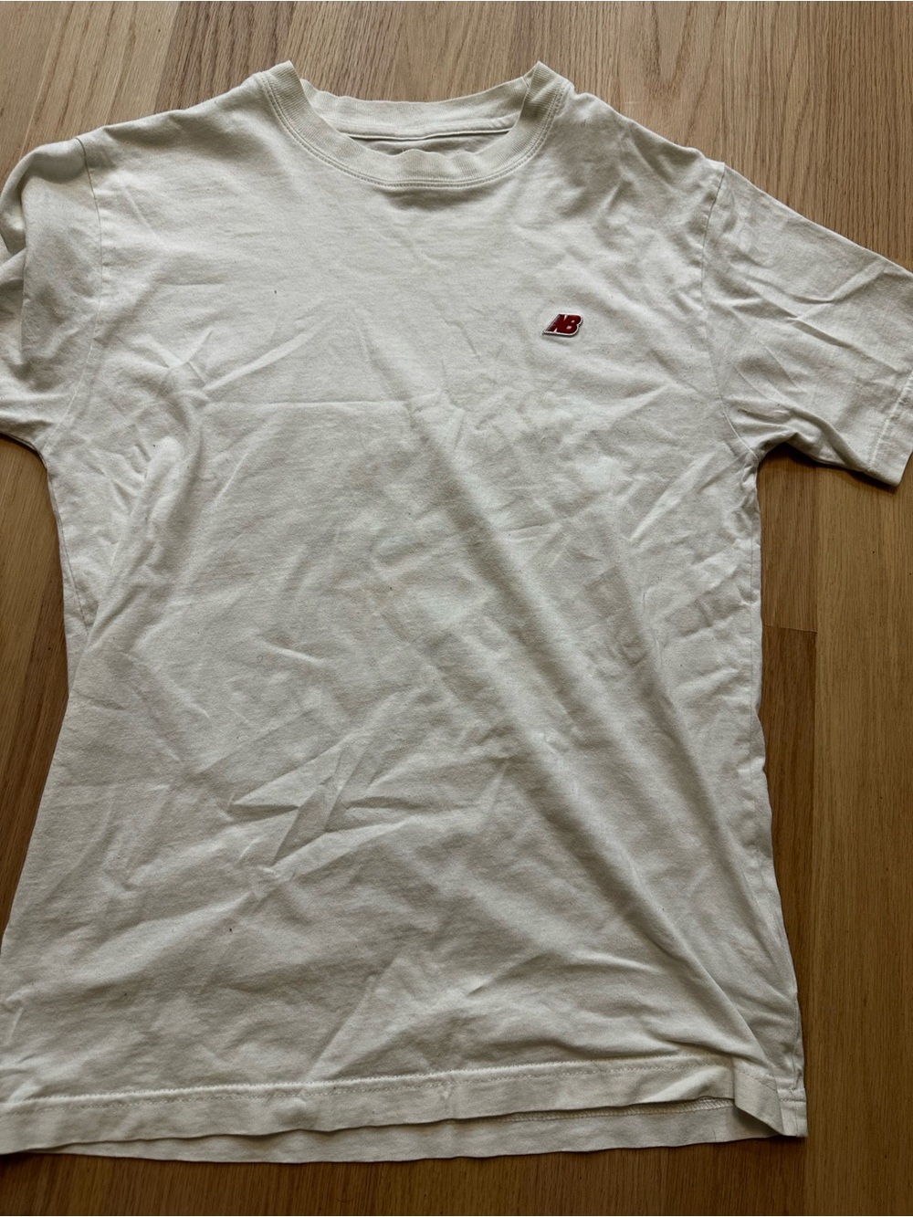 New Balance Men’s Off-White Crew Tee with Small Red NB Logo